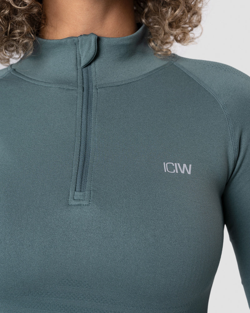 define cropped 1/4 zip jungle green