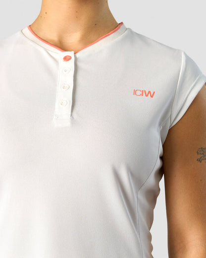 training pique polo white/coral wmn